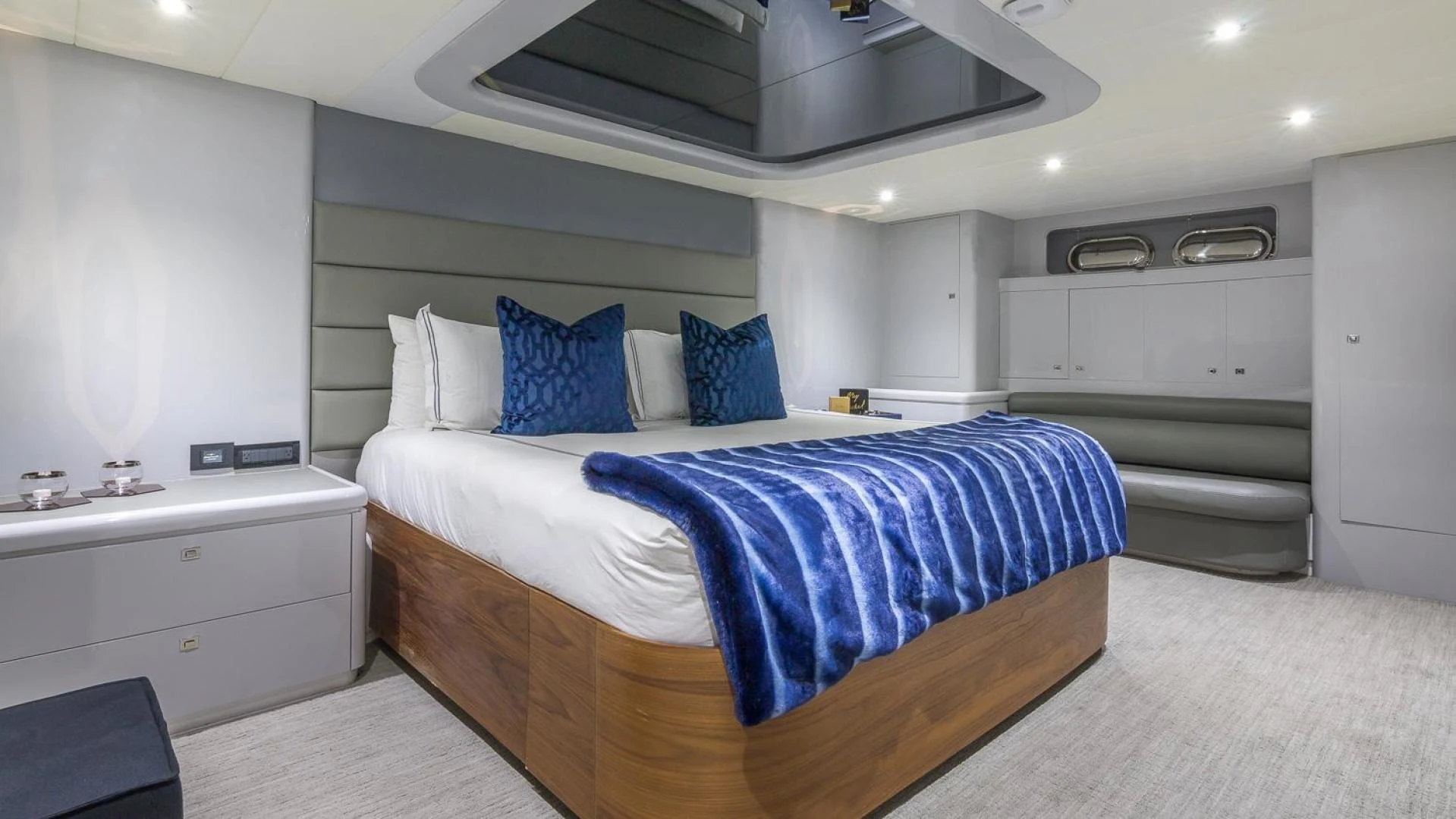 a bedroom with a bed and a sink aboard NIRVANA Yacht for Sale