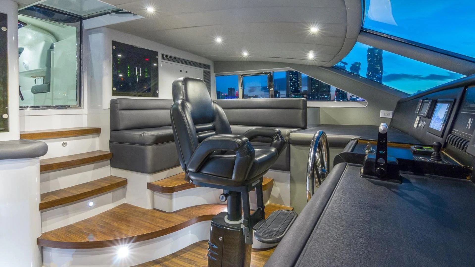 a room with a couch and a tv aboard NIRVANA Yacht for Sale