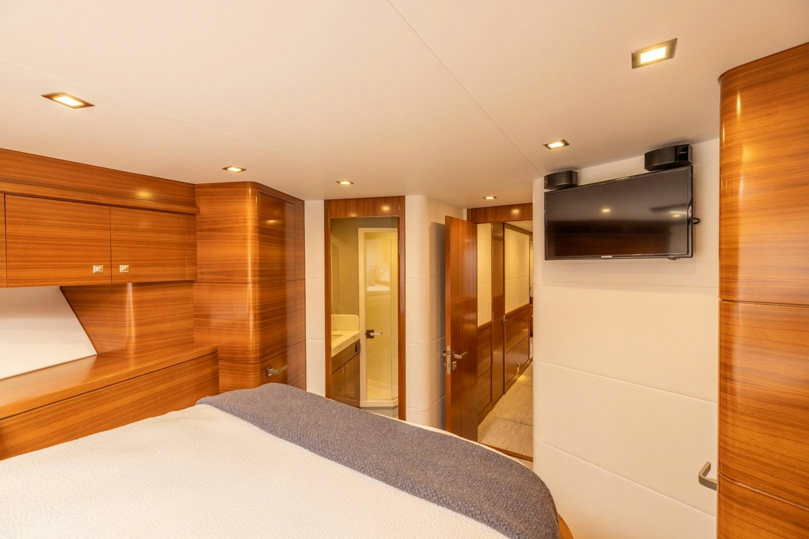 a hotel room with a bed and a mirror aboard BONNY READ Yacht for Sale