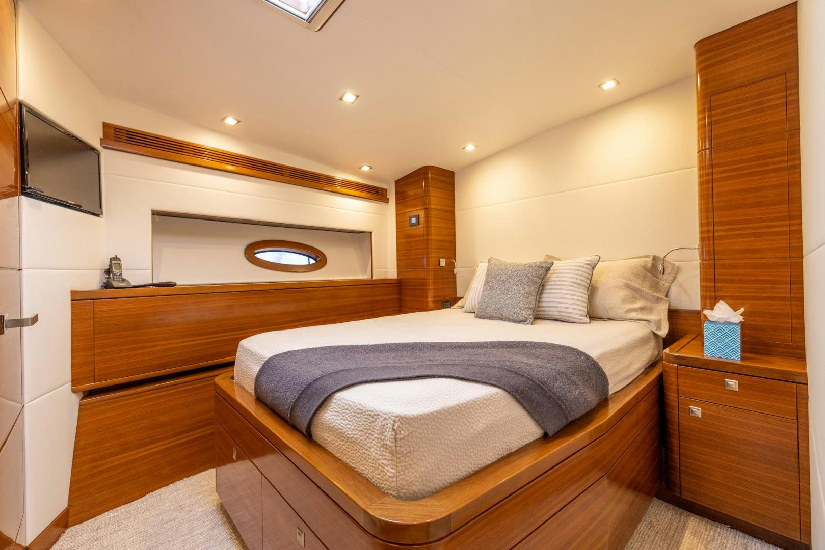 a bedroom with a bed and a television aboard BONNY READ Yacht for Sale