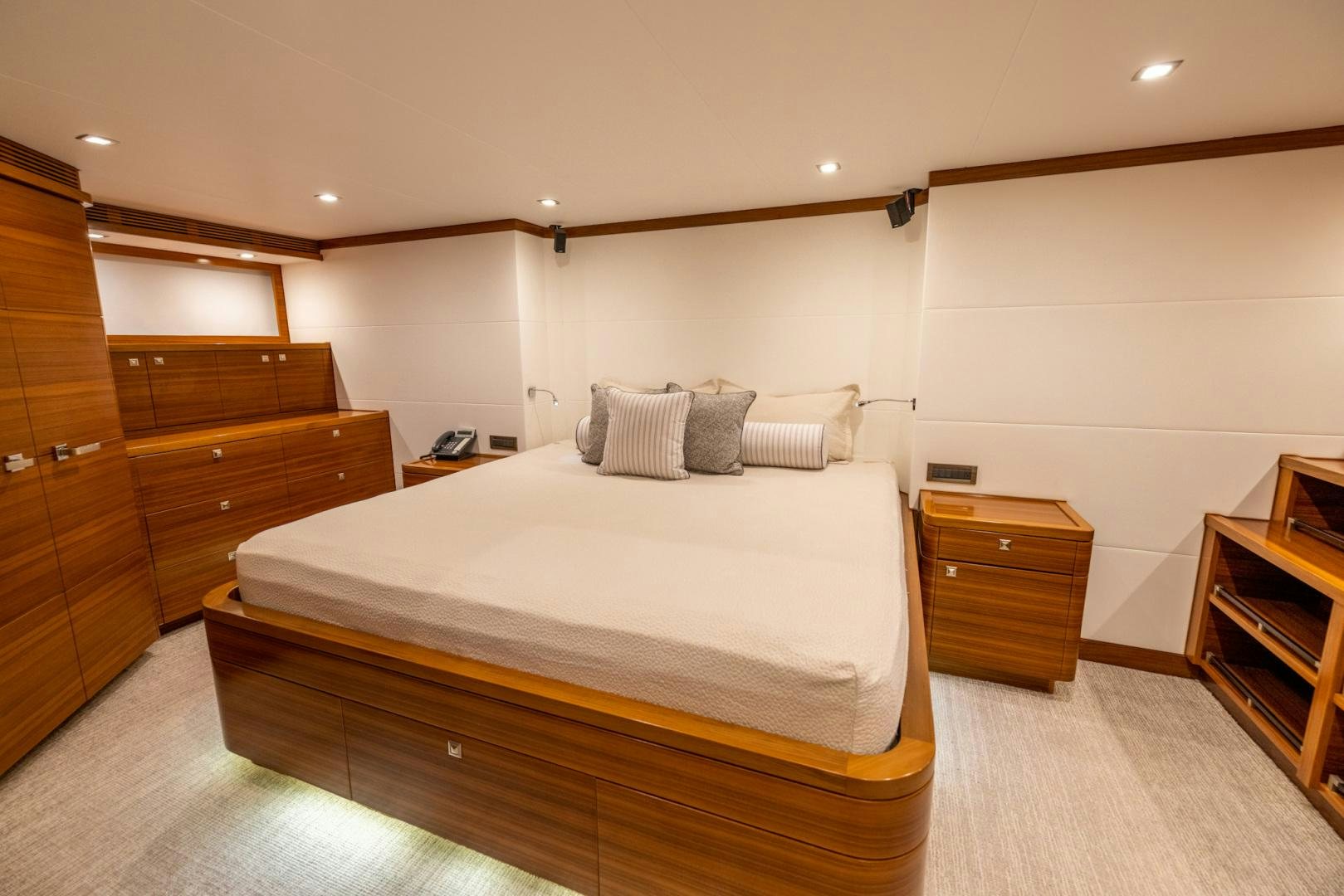 a bedroom with a bed and dresser aboard BONNY READ Yacht for Sale