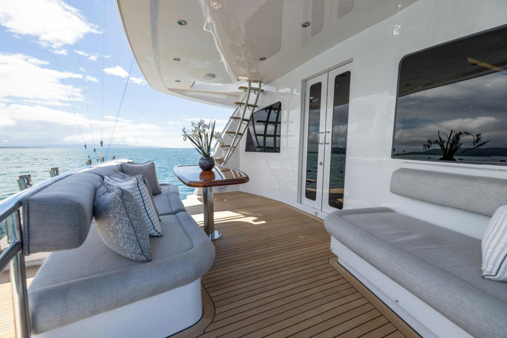 a room with a couch and a table and a window aboard BONNY READ Yacht for Sale