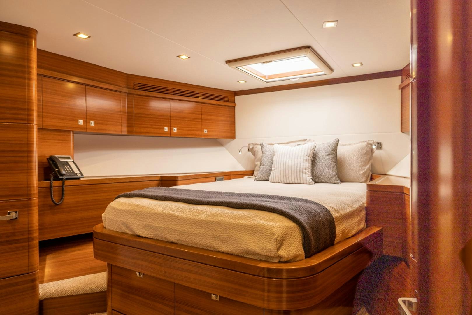 a bed with a phone on it aboard BONNY READ Yacht for Sale