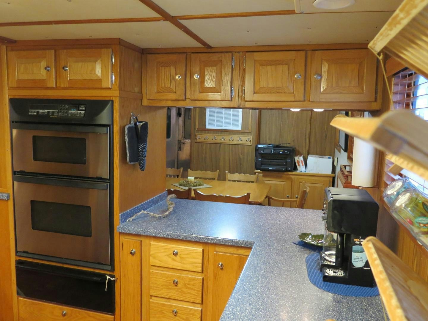 a kitchen with wooden cabinets aboard WANDERER Yacht for Sale