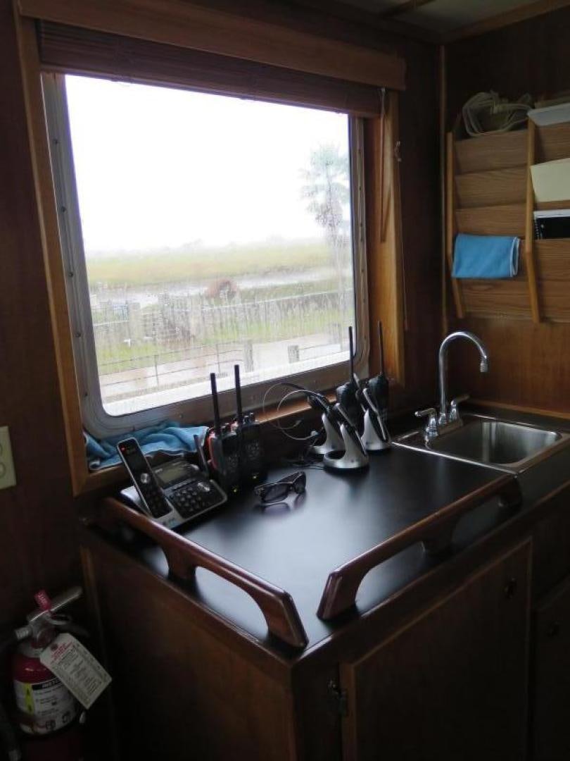 a kitchen sink with a window aboard WANDERER Yacht for Sale