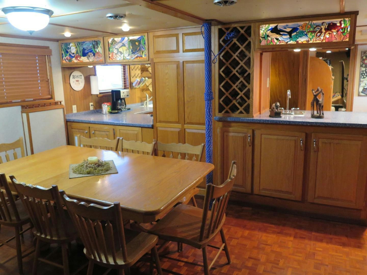 a kitchen with a dining table aboard WANDERER Yacht for Sale