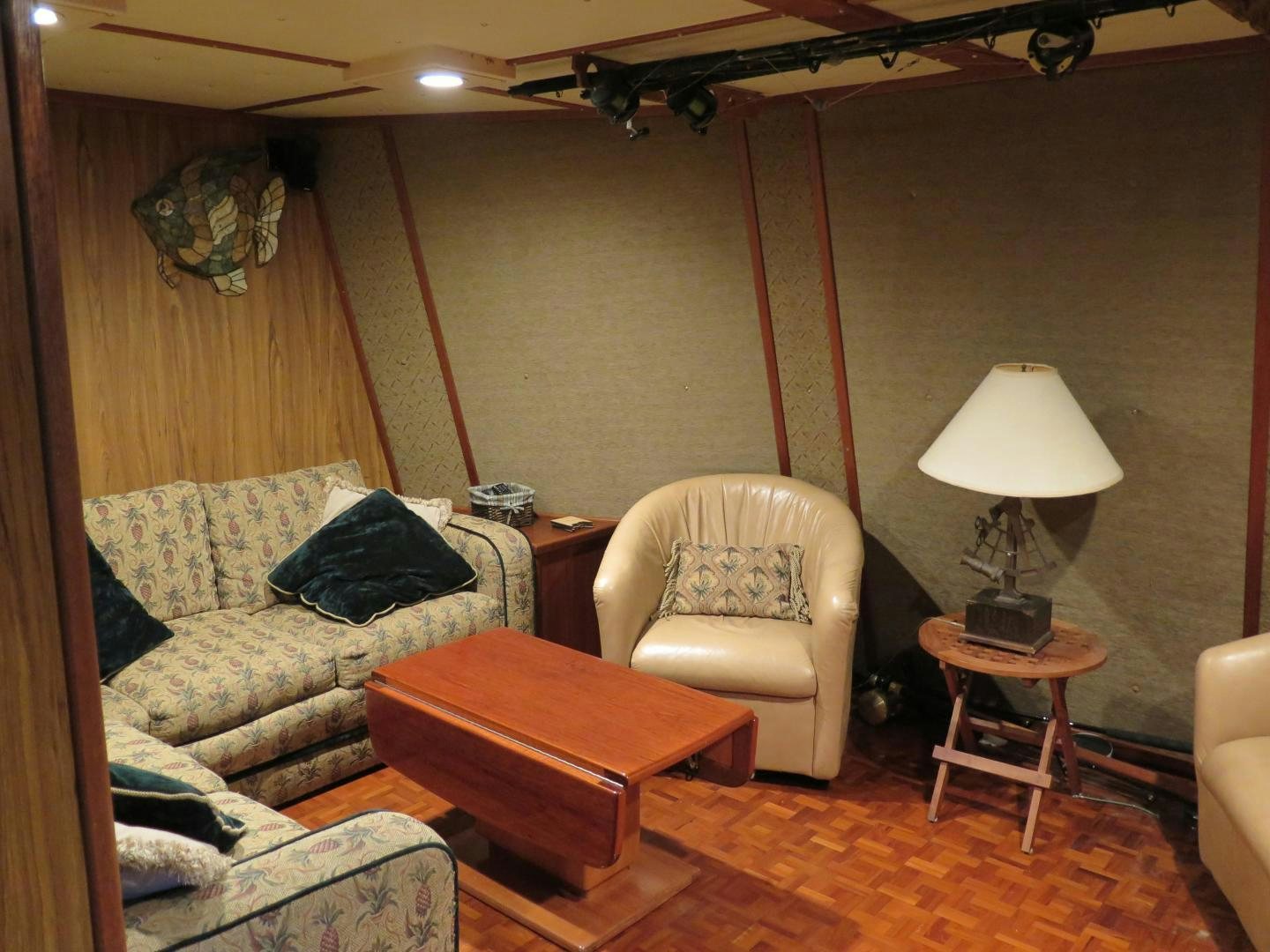 a living room with a couch and a table aboard WANDERER Yacht for Sale