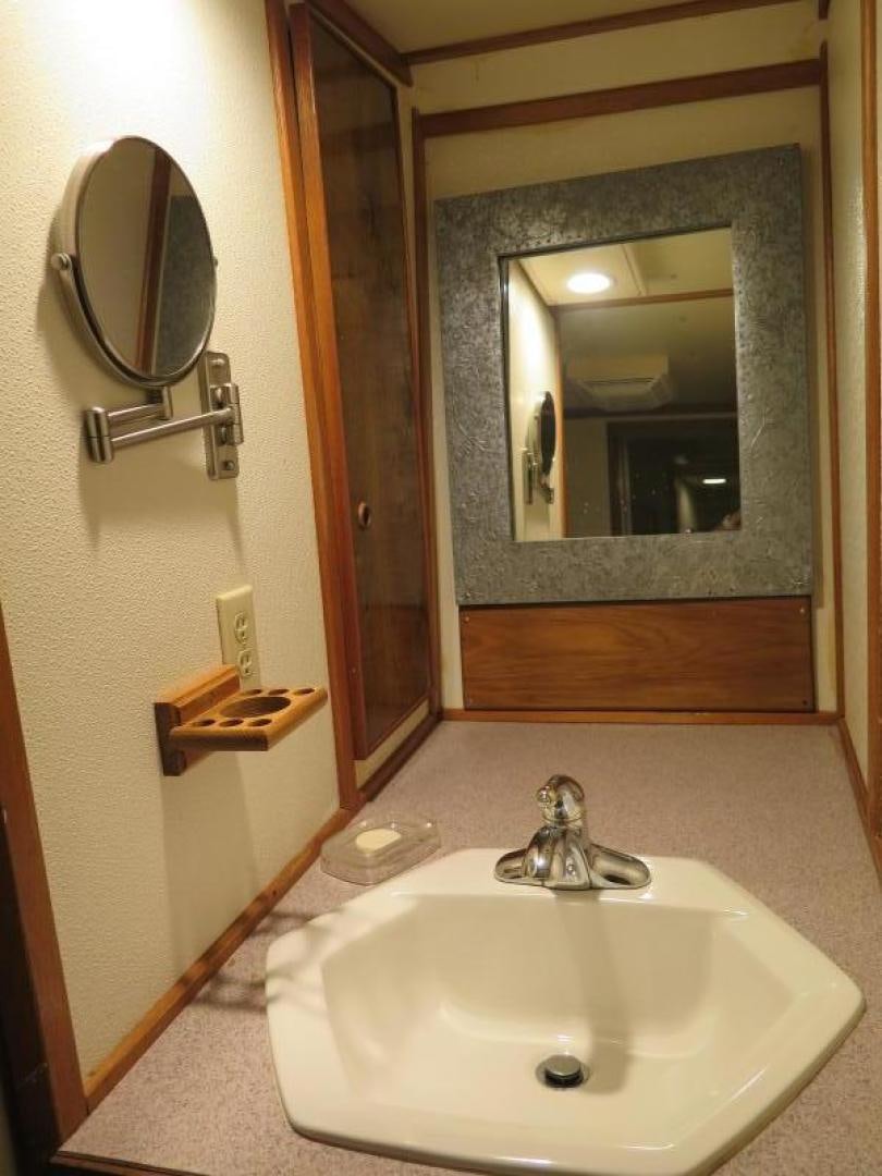 a bathroom with a mirror and a sink aboard WANDERER Yacht for Sale