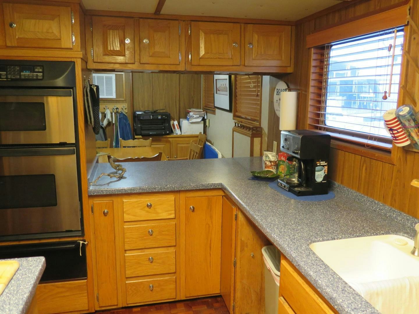 a kitchen with a sink and stove aboard WANDERER Yacht for Sale