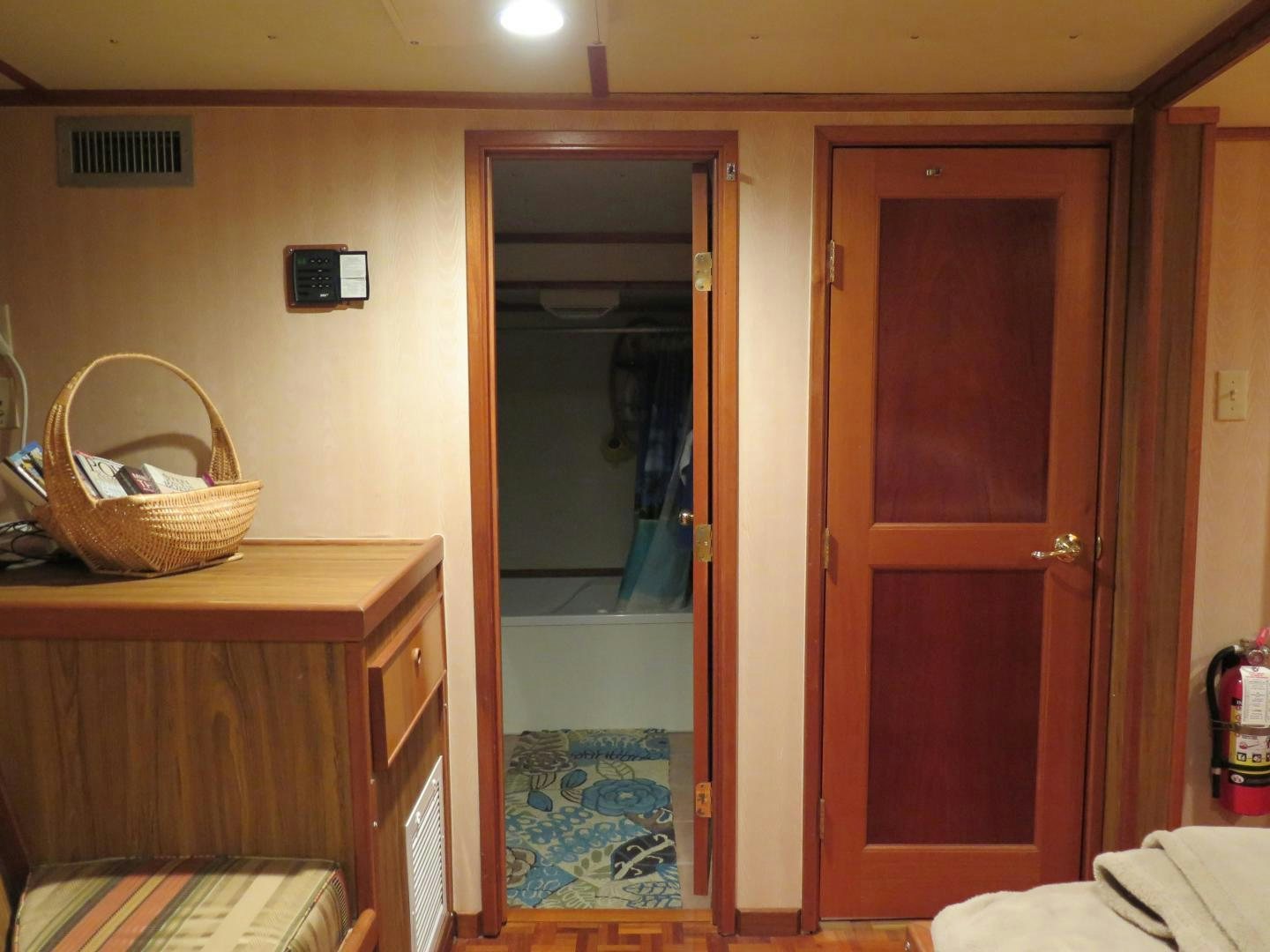 a bathroom with a basket aboard WANDERER Yacht for Sale