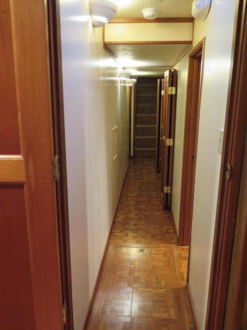 a hallway with doors aboard WANDERER Yacht for Sale