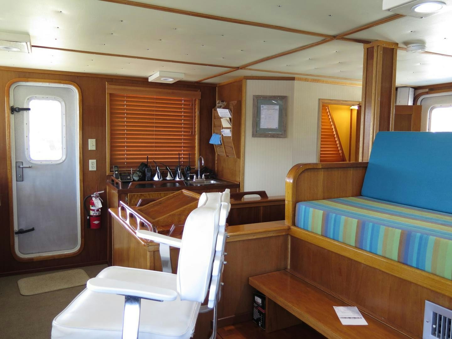 a room with a bed and a desk aboard WANDERER Yacht for Sale