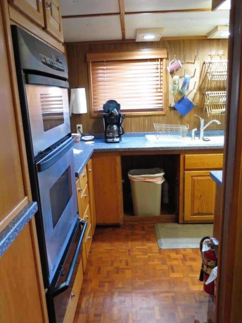 a kitchen with a stove and oven aboard WANDERER Yacht for Sale