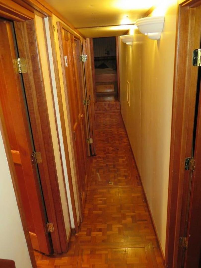a hallway with doors aboard WANDERER Yacht for Sale