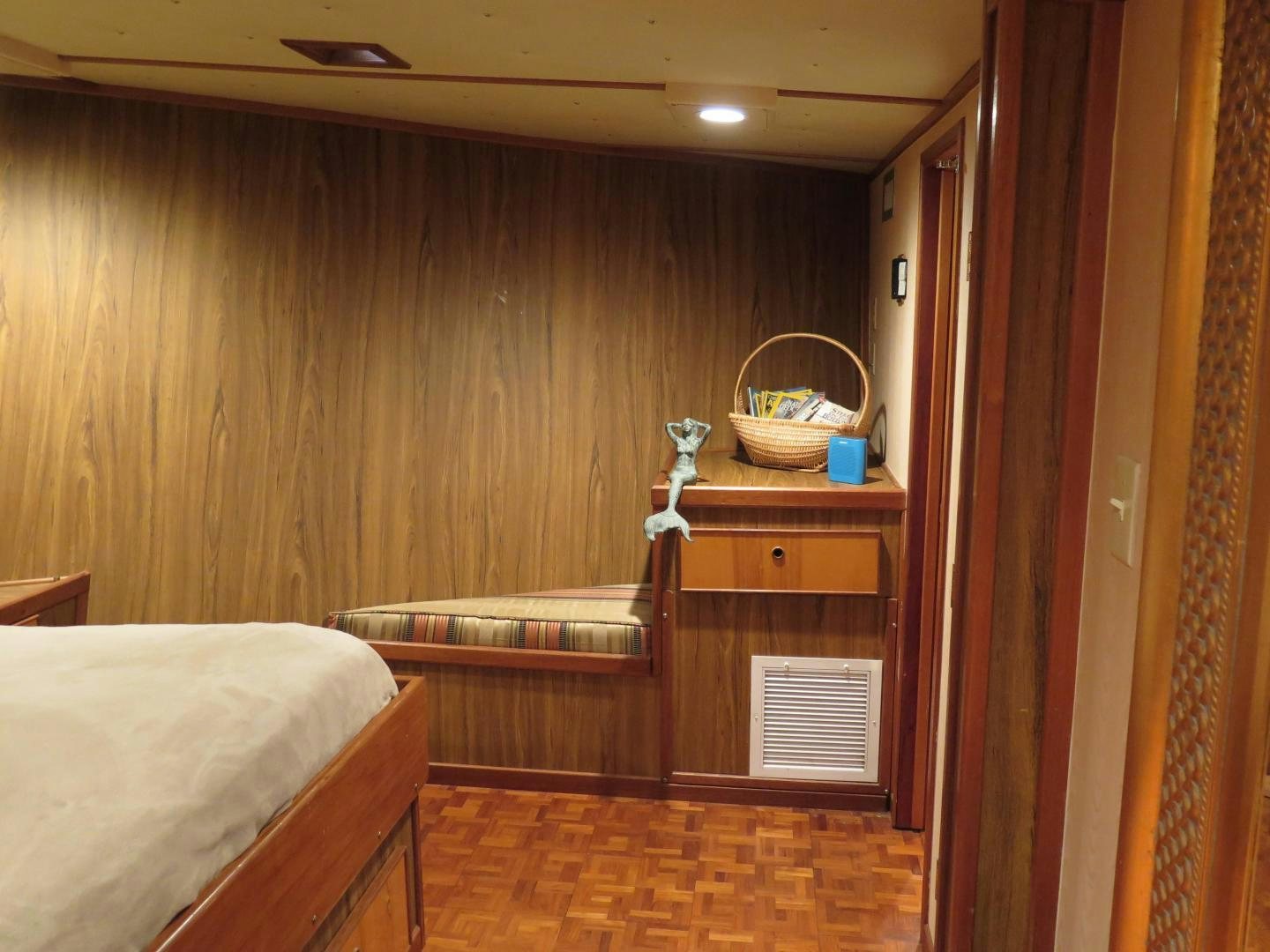 a bed and a table in a room aboard WANDERER Yacht for Sale