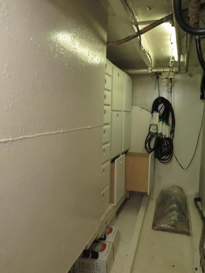 a room with a wall and a bicycle aboard WANDERER Yacht for Sale