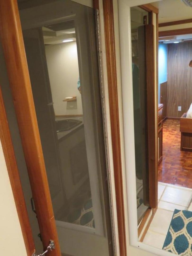 a bathroom with a glass door aboard WANDERER Yacht for Sale