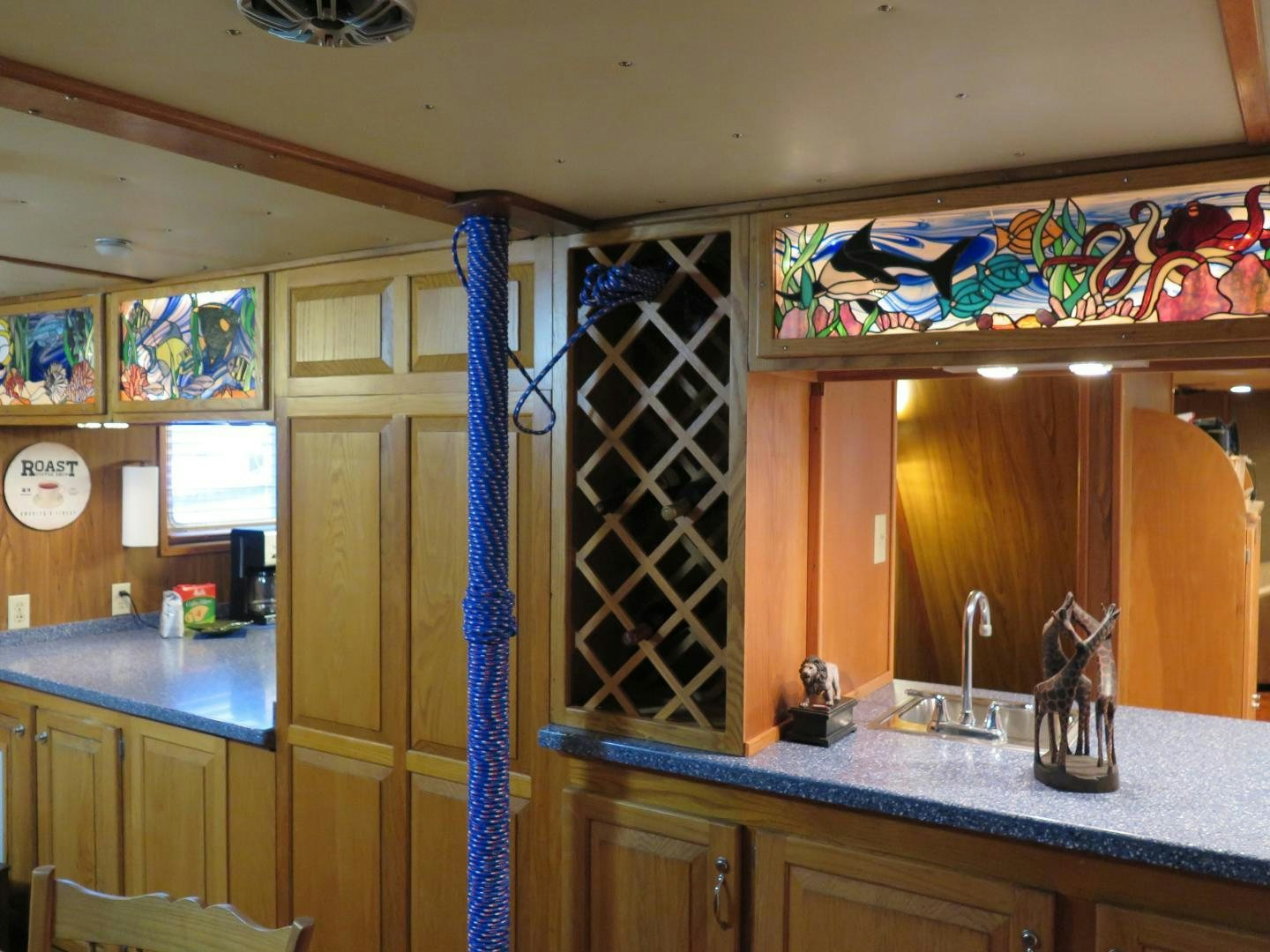 a kitchen with a blue countertop aboard WANDERER Yacht for Sale