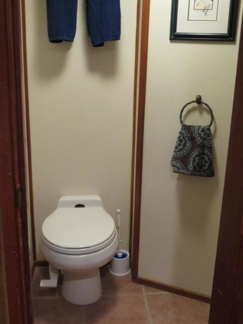 a toilet with a towel over it aboard WANDERER Yacht for Sale