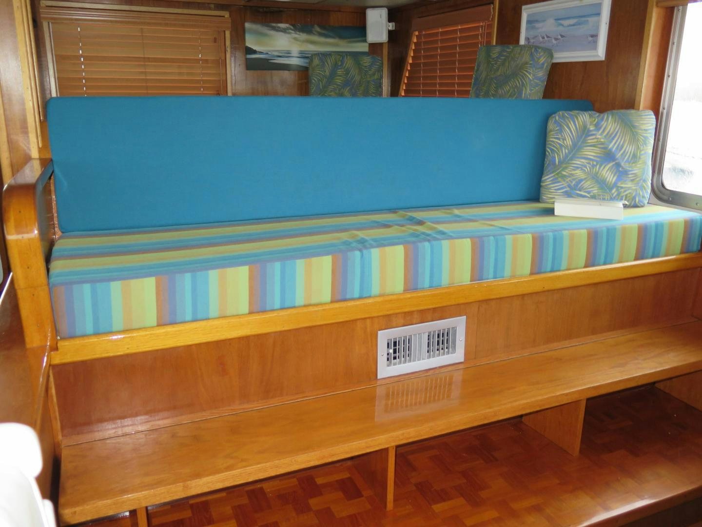 a bench with a sign on it aboard WANDERER Yacht for Sale