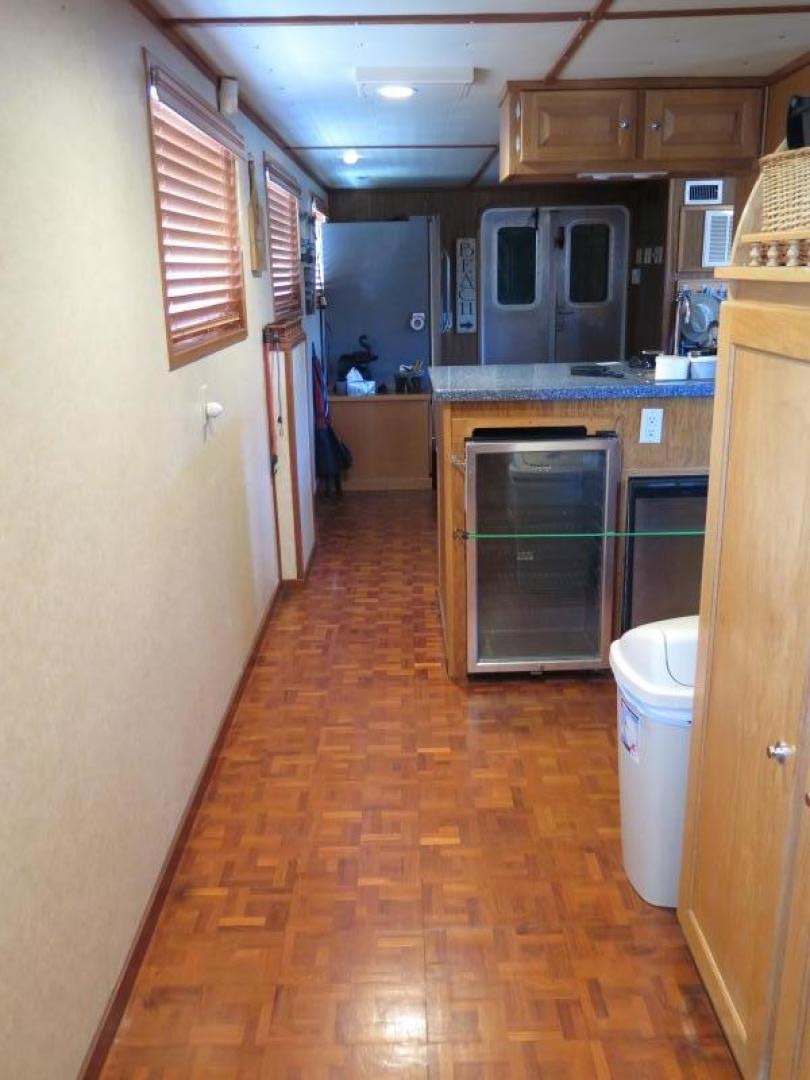 a kitchen with a stove and cabinets aboard WANDERER Yacht for Sale