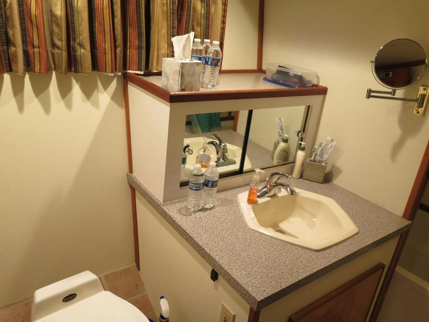 a bathroom with a sink and mirror aboard WANDERER Yacht for Sale