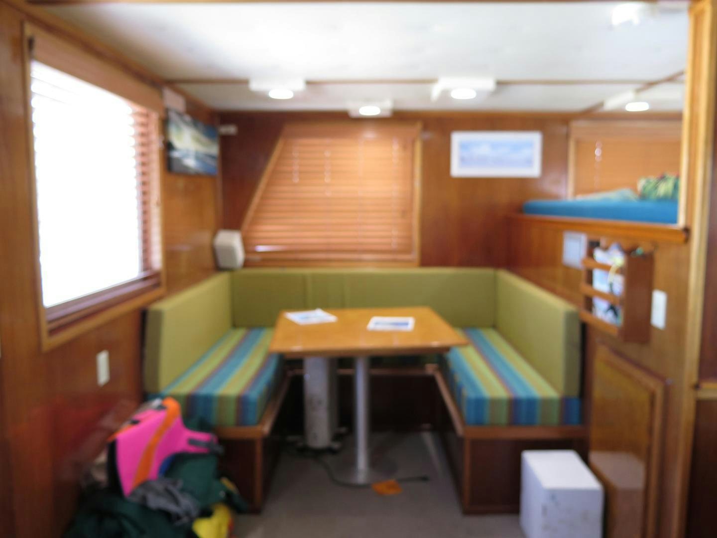 a room with bunk beds and desks aboard WANDERER Yacht for Sale