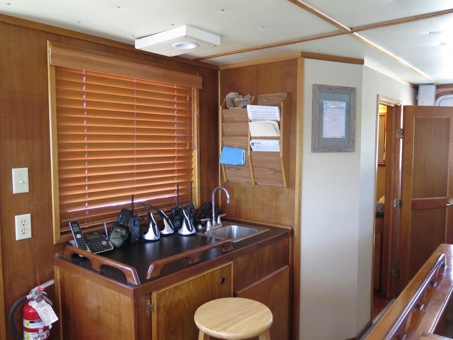 a kitchen with a sink and cabinets aboard WANDERER Yacht for Sale