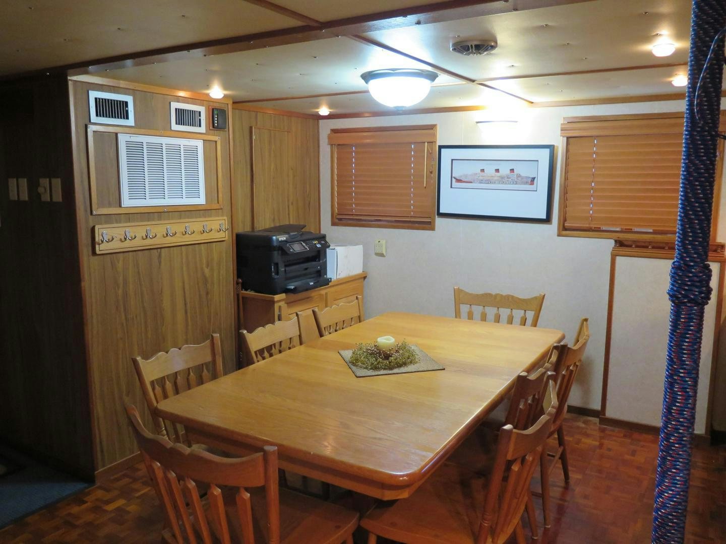 a dining table in a room aboard WANDERER Yacht for Sale