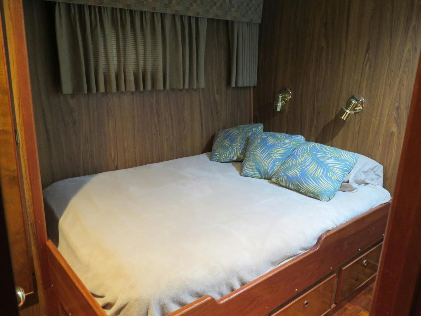 a bed with a white sheet aboard WANDERER Yacht for Sale