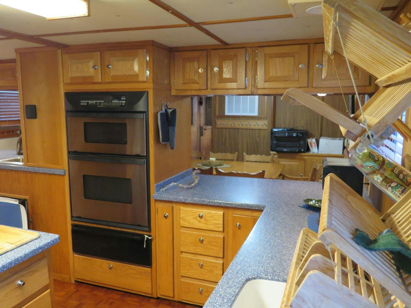 a kitchen with wooden cabinets aboard WANDERER Yacht for Sale