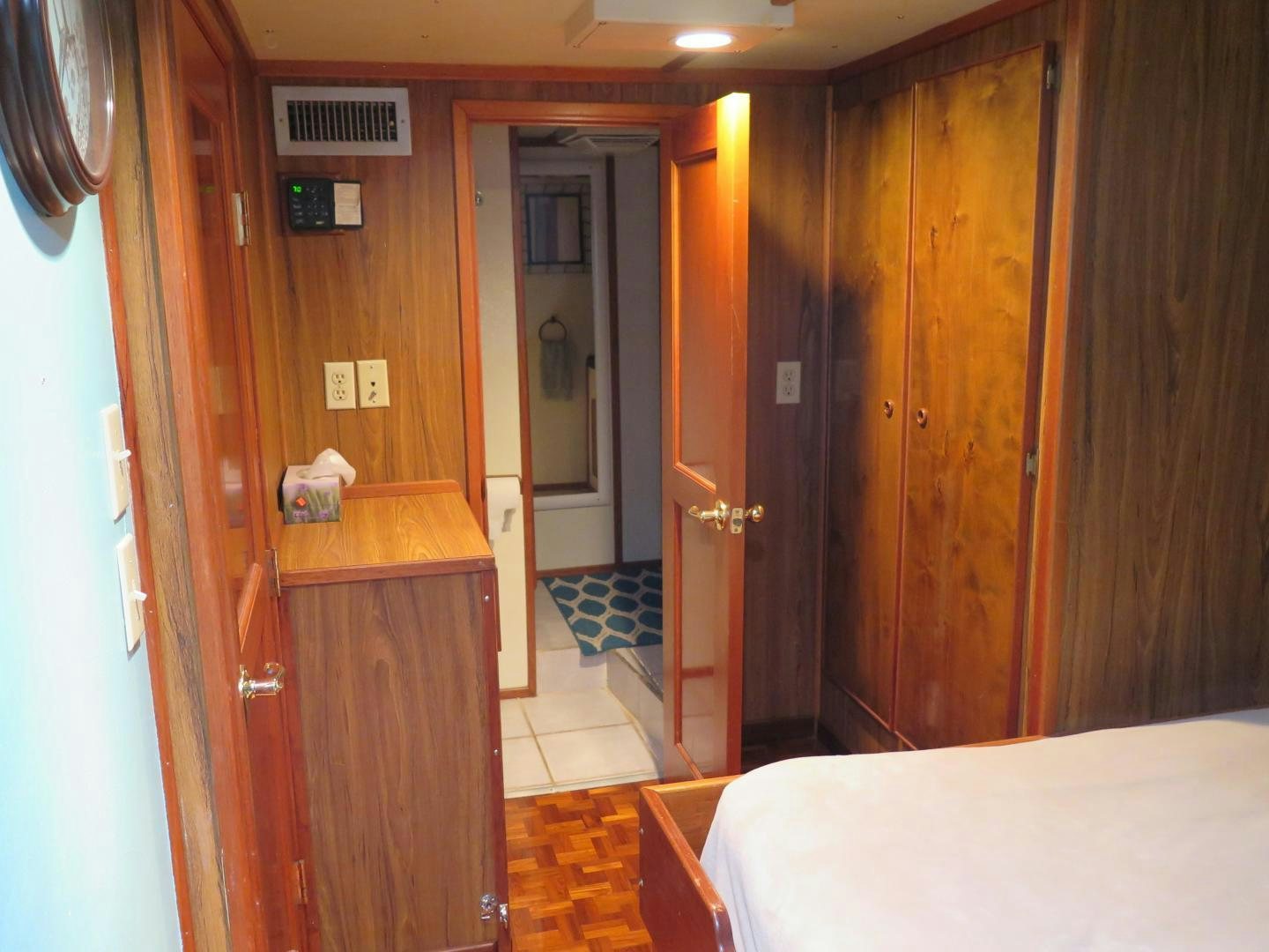 a room with a bed and a desk aboard WANDERER Yacht for Sale