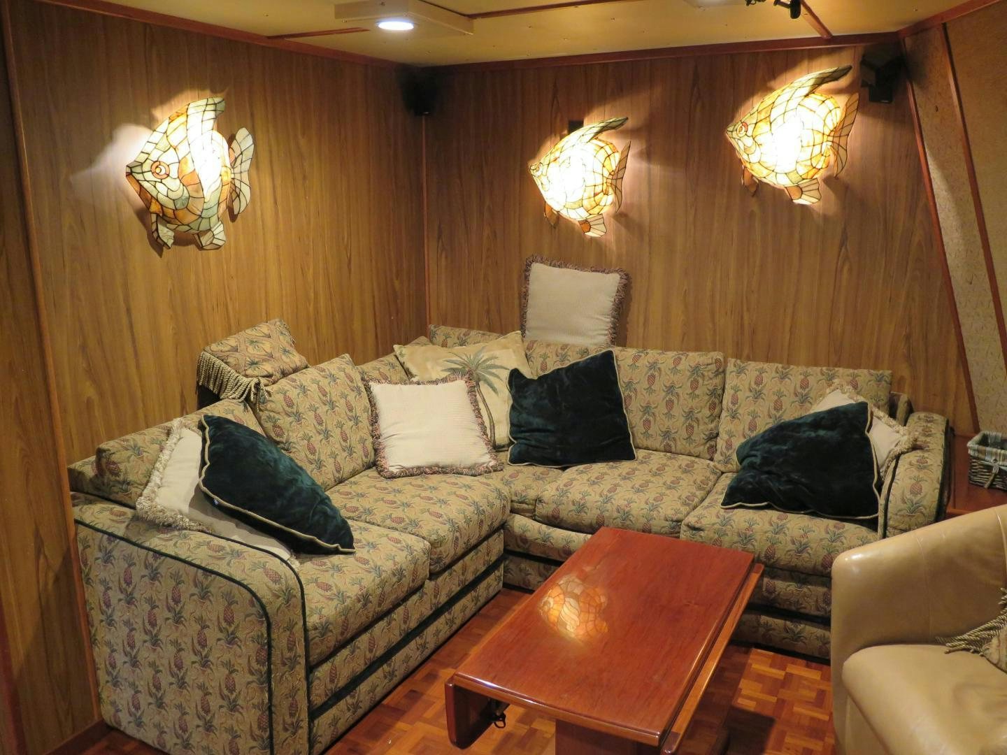 a living room with a couch and a table aboard WANDERER Yacht for Sale