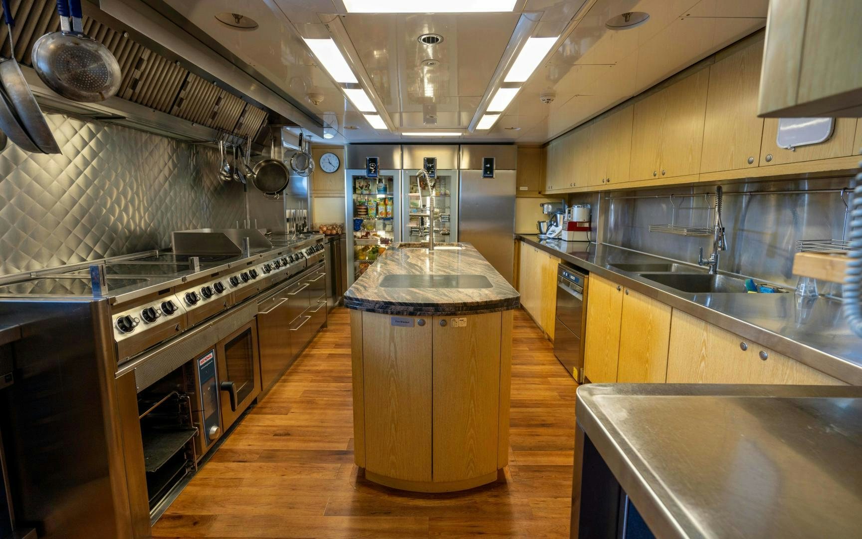 a kitchen with stainless steel appliances aboard 4 ROSES Yacht for Sale