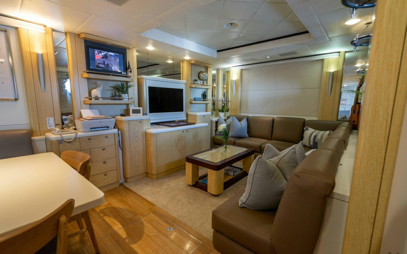 a living room with a couch and a tv aboard 4 ROSES Yacht for Sale