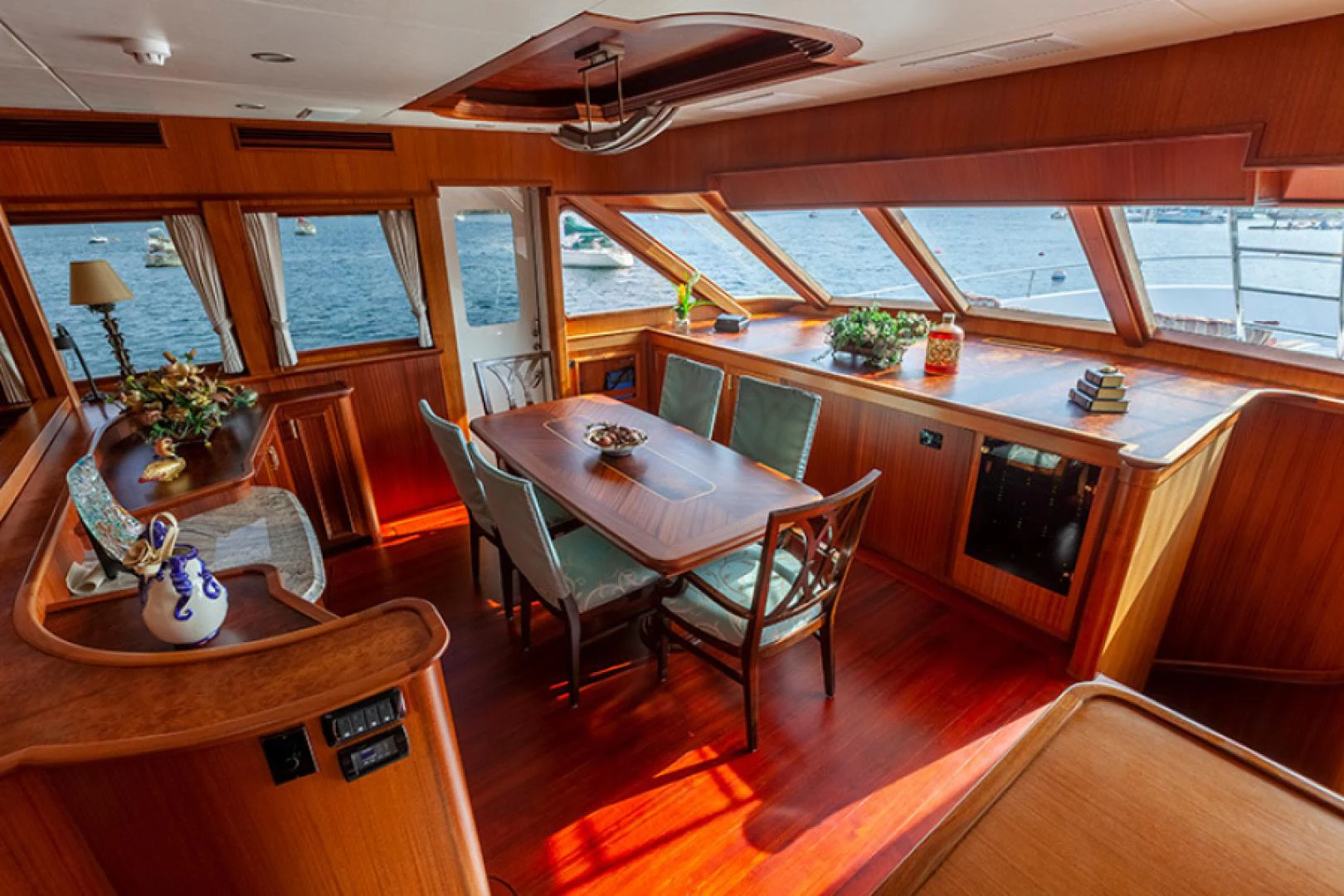 a dining room with a table and chairs aboard RHAPSODY Yacht for Sale