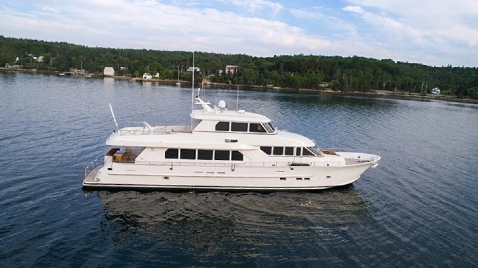 a white yacht in the water aboard RHAPSODY Yacht for Sale