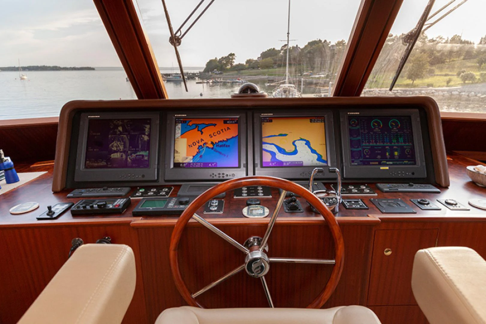 a group of monitors on a table aboard RHAPSODY Yacht for Sale