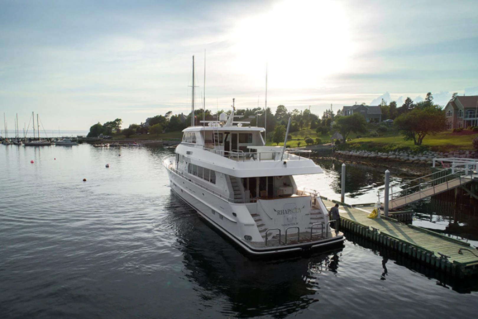 a boat is parked at a dock aboard RHAPSODY Yacht for Sale