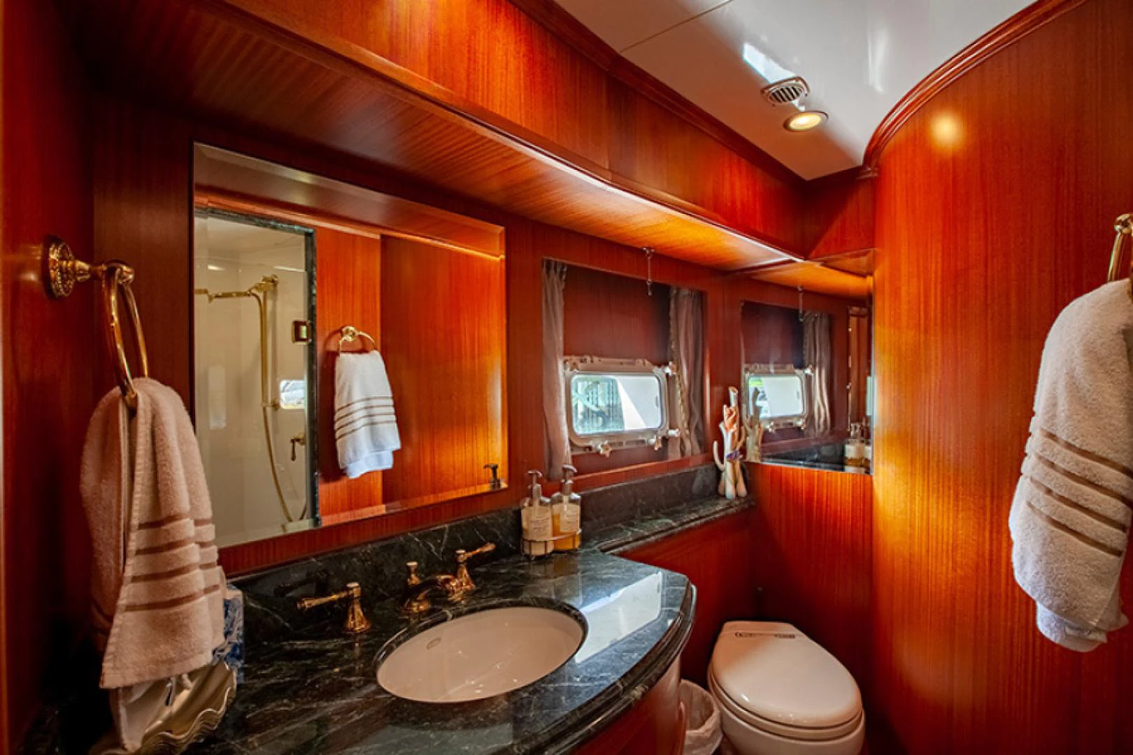 a bathroom with a large mirror aboard RHAPSODY Yacht for Sale