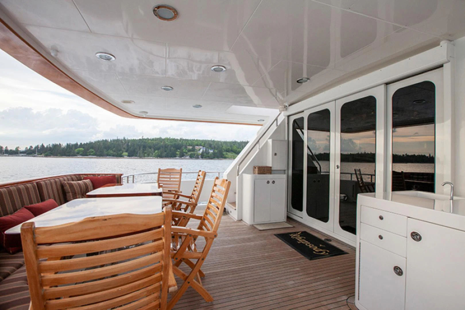a boat with a table and chairs aboard RHAPSODY Yacht for Sale