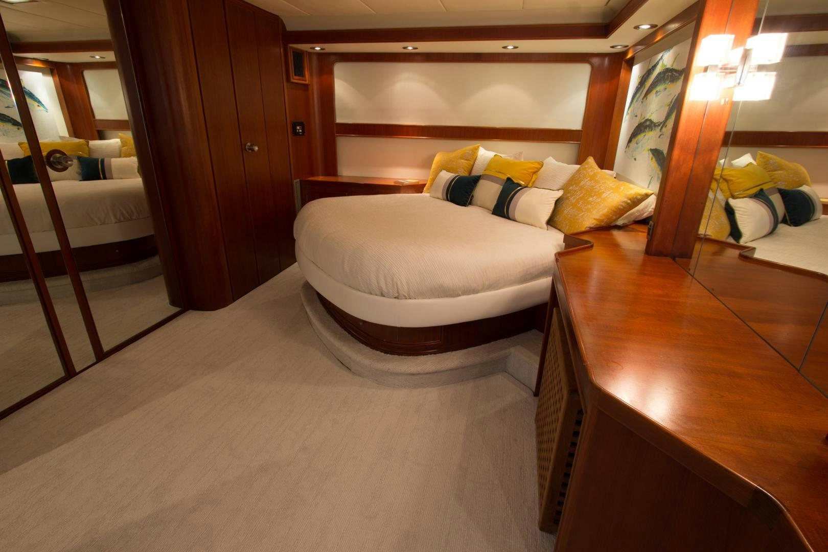 a room with a bed and a mirror aboard SEAEO Yacht for Sale