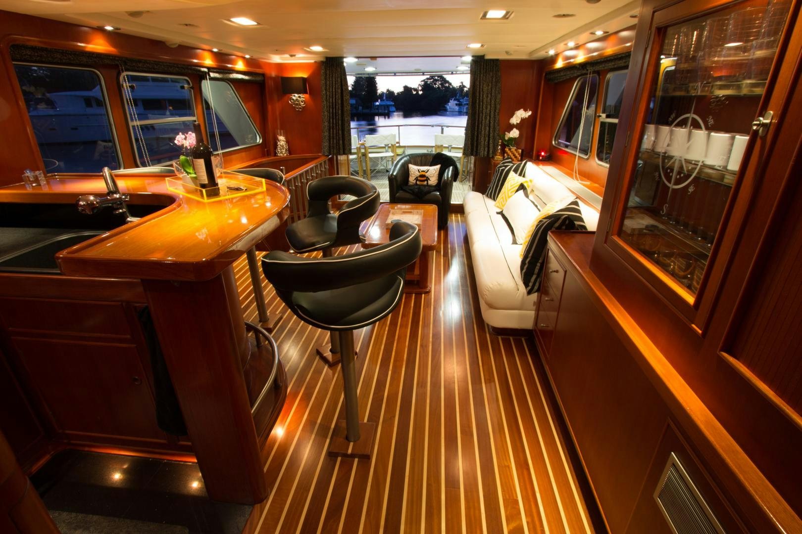 a room with a table and chairs aboard SEAEO Yacht for Sale