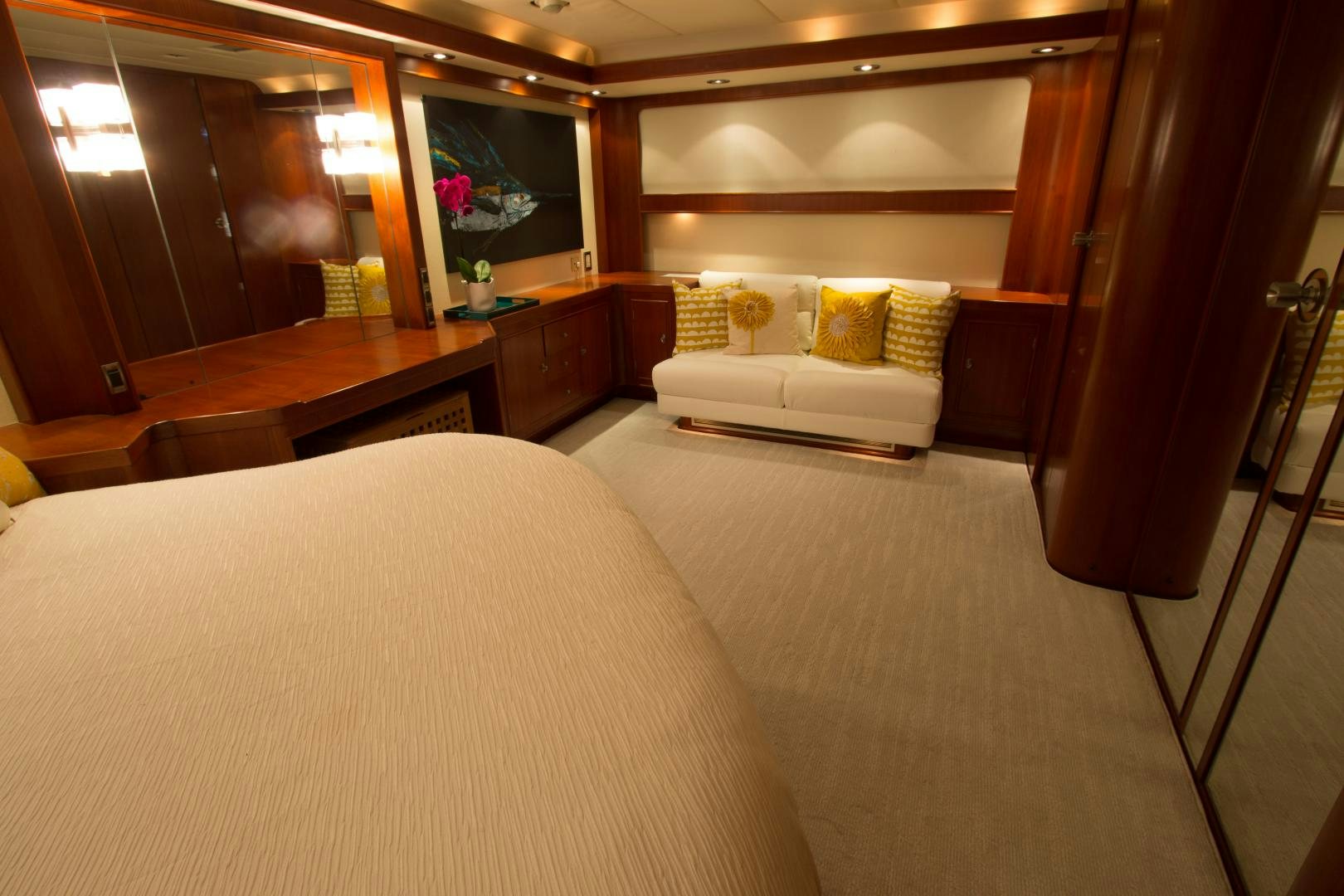 a room with a bed and a couch aboard SEAEO Yacht for Sale