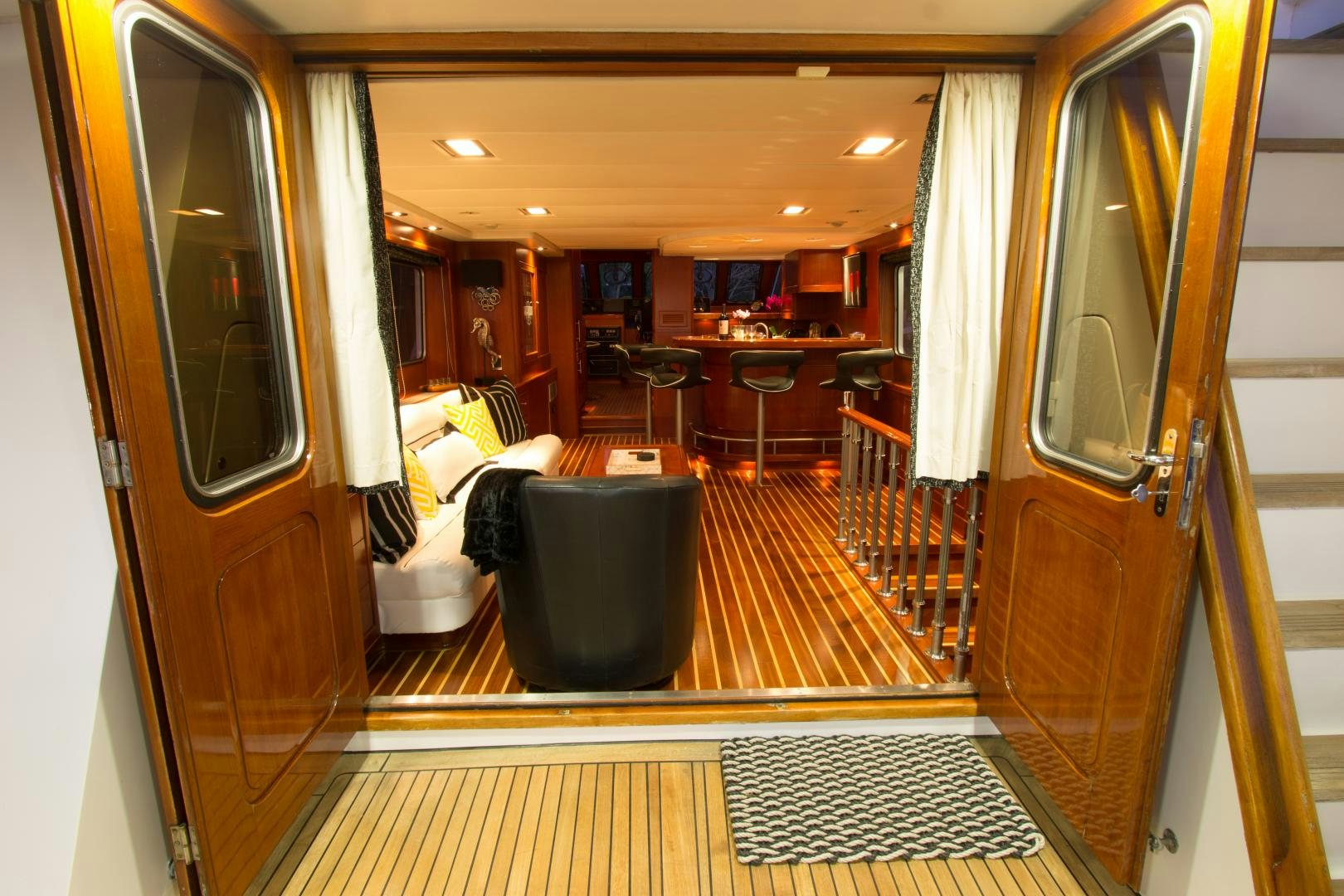 a room with chairs and tables aboard SEAEO Yacht for Sale