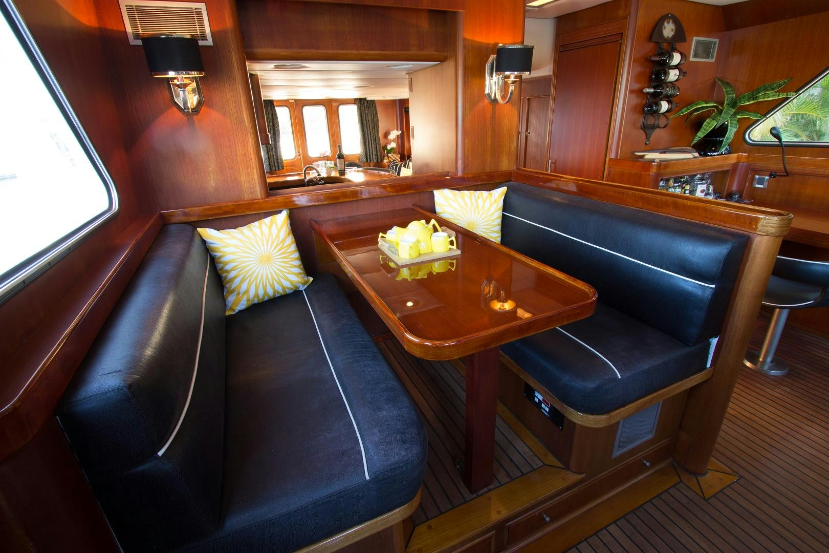 a room with a table and chairs aboard SEAEO Yacht for Sale