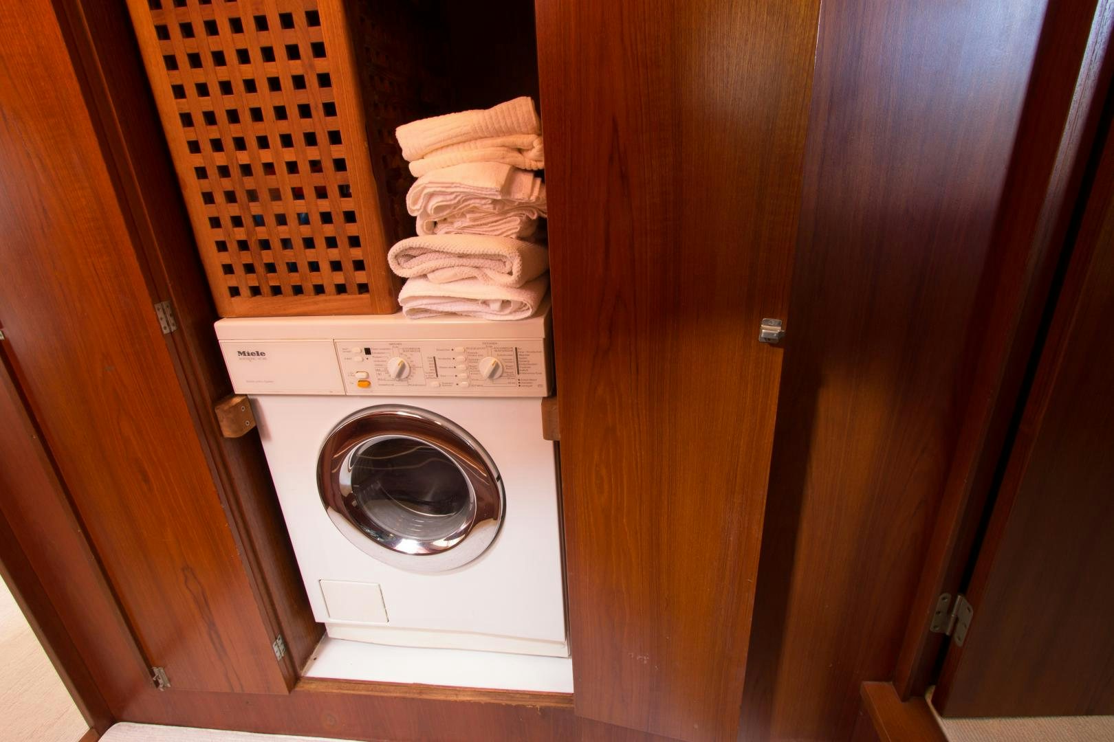 a washing machine in a closet aboard SEAEO Yacht for Sale