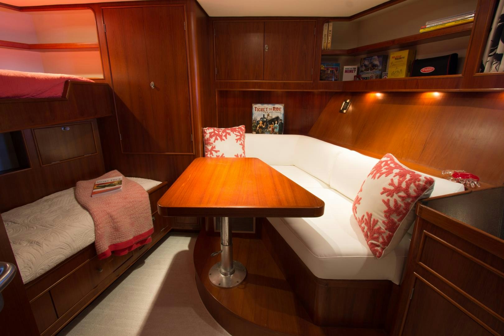 a room with a bed and a lamp aboard SEAEO Yacht for Sale