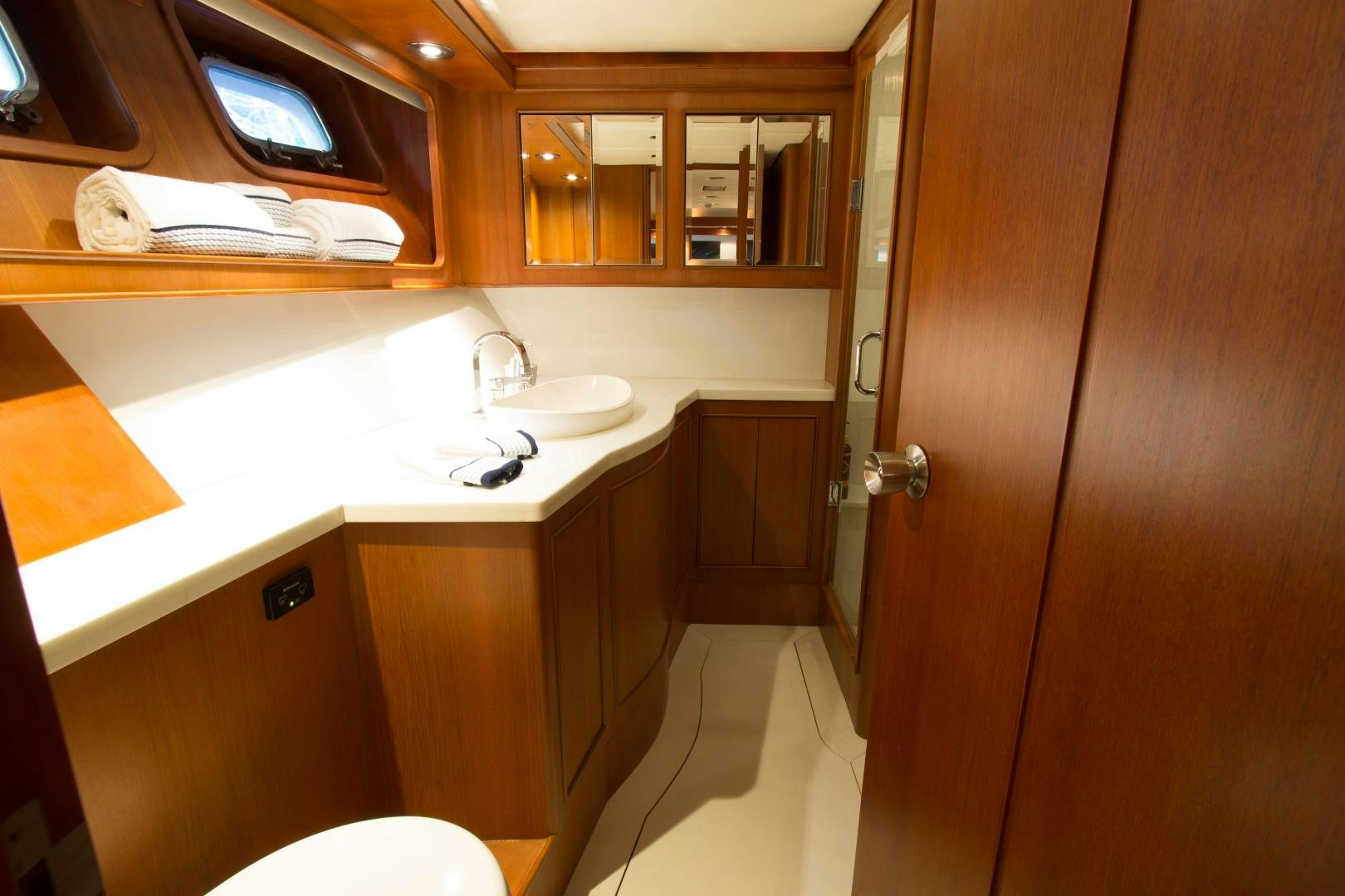 a bathroom with a sink and a mirror aboard SEAEO Yacht for Sale
