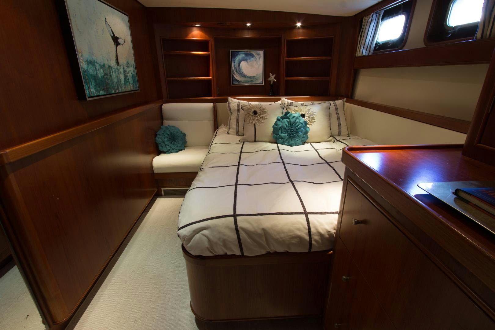 a room with a bed and a desk aboard SEAEO Yacht for Sale